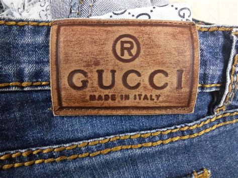 fake gucci jeans labels|are gucci jeans genuine.